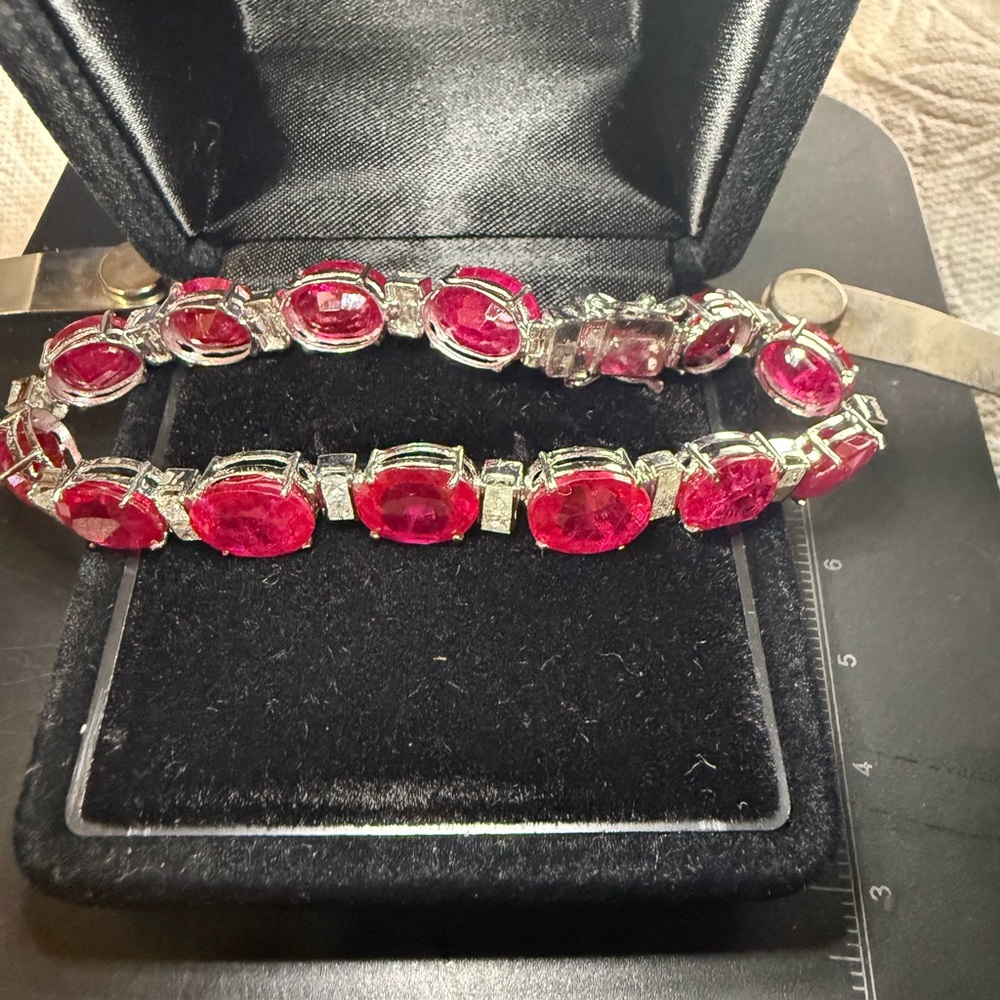 Tennis bracelet in 14k white gold and 40 carat lab rubies.
